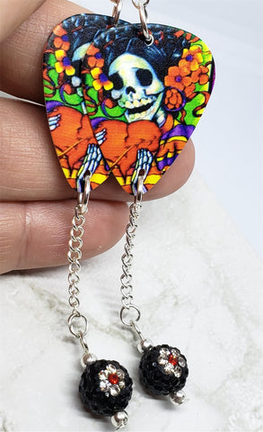 Sugar Skull Surrounded By Flowers Holding a Heart Guitar Pick Earrings with Flower Pave Bead Dangles