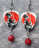 Woman with Katana Guitar Pick Earrings with Red Pave Bead Dangles
