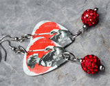 Woman with Katana Guitar Pick Earrings with Red Pave Bead Dangles