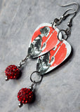 Woman with Katana Guitar Pick Earrings with Red Pave Bead Dangles