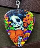 Sugar Skull with a Large Heart Guitar Pick Necklace on a Purple Rolled Cord