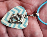 Two Jumping Dolphins on a Blue Chevron Guitar Pick Necklace with Blue Rolled Cord