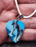 Trio of Jumping Dolphins Guitar Pick Necklace on White Rolled Cord
