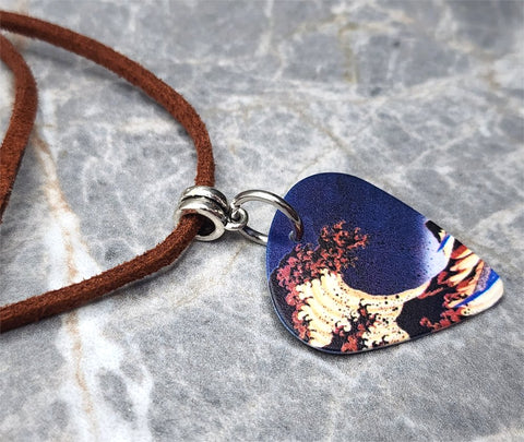 A Color Variation of The Great Wave Guitar Pick Necklace with Black Suede Cord