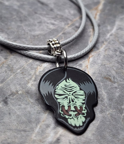 Zombie with Their Mouth Sewn Shut Guitar Pick Necklace on Gray Rolled Cord