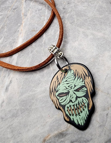 Zombie with Their Mouth Sewn Shut Guitar Pick Necklace on Brown Suede Cord