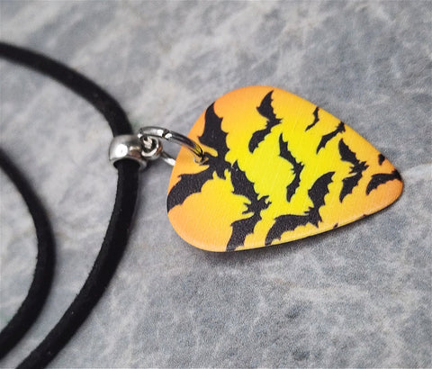 Swarm of Bats Orange Guitar Pick Necklace with Black Suede Cord