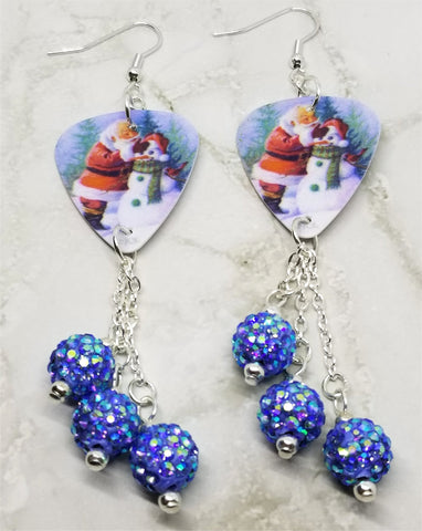 Santa Making a Snowman Scene Guitar Pick Earrings with Blue AB Pave Bead Dangles