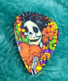 Sugar Skull with a Flower Crown Holding a Heart Guitar Pick Pin or Tie Tack