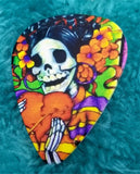 Sugar Skull with a Flower Crown Holding a Heart Guitar Pick Pin or Tie Tack