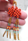 Orange Dyed Magnesite Celtic Knot Bead Earrings with Seed Bead Dangles
