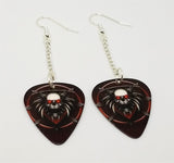 Dangling Skull on a Dark Red Background Guitar Pick Earrings