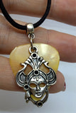 Masquerade Mask Charm with a Gold MOP Guitar Pick on a Black Suede Cord Necklace