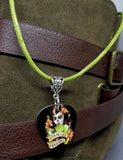 Sugar Skull Woman Guitar Pick on a Green Rolled Cord Necklace