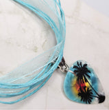 Palm Tree Guitar Pick Necklace on a Blue Ribbon Cord