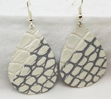 White Embossed Tear Drop Shaped Leather Earrings with Silver Coloring