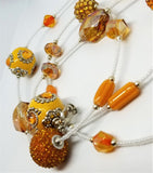 Orange Glass, Rhinestone and Acrylic Beads On White Seed Bead Necklace