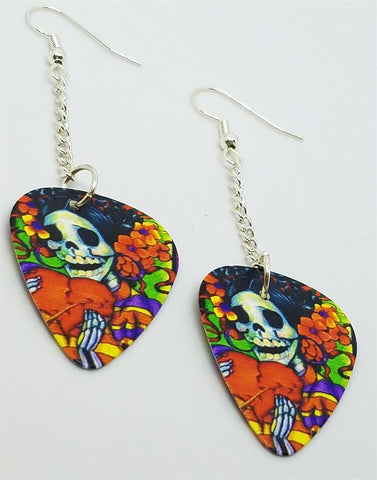 Sugar Skull Surrounded By Flowers Holding a Heart Dangling Guitar Pick Earrings