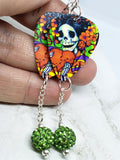 Sugar Skull Surrounded By Flowers Holding a Heart Guitar Pick Earrings with Green Pave Bead Dangles